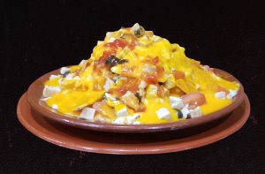 Imagen de patatas teja con salsa cheddar de La Baranda